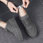 Close-up detail of men's breathable lace-up sneakers