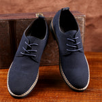 Side view of men's leather and suede casual sneakers